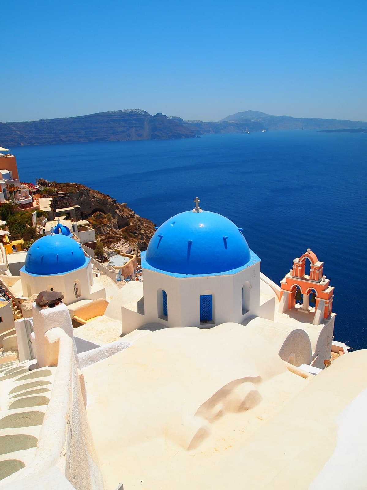 Blue-domed church above the caldera in Oia, Santorini